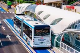 bus rapid transit vehicle at station in a dedicated street lane